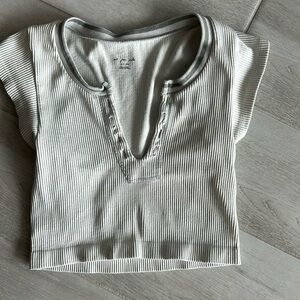 Ivory colors out from under crop top